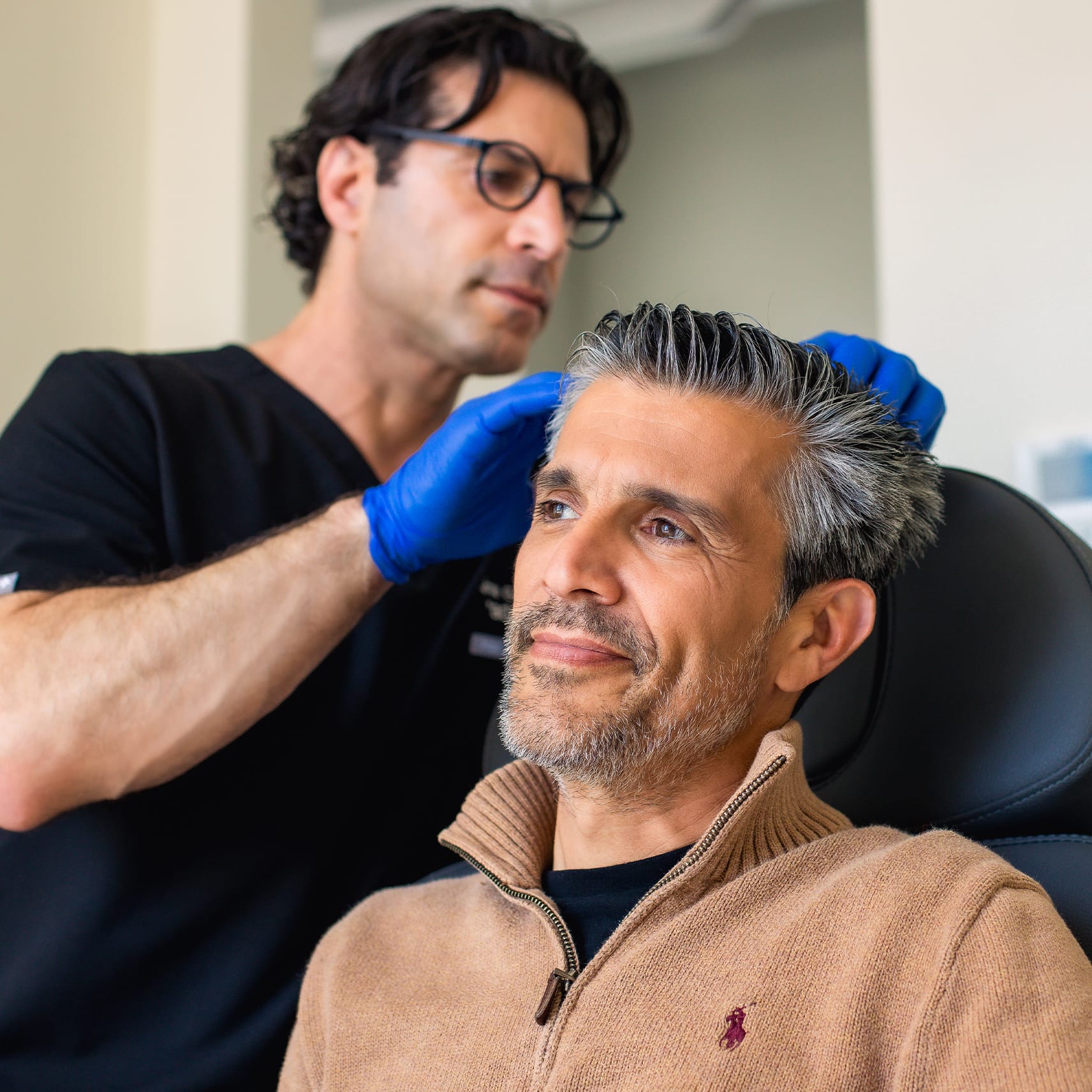 Jamie Gabel with hair restoration patient