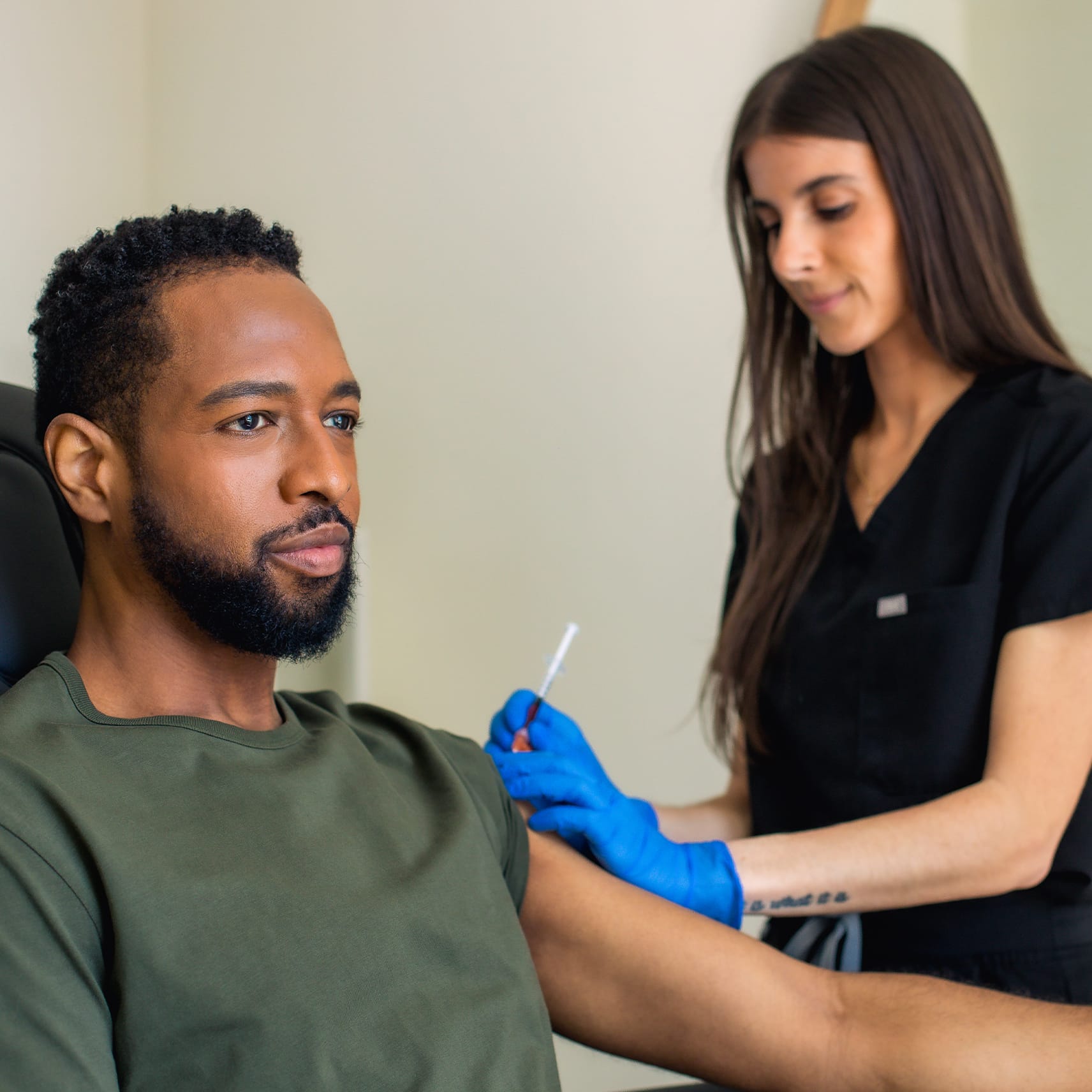 man getting a vitamin injection shot