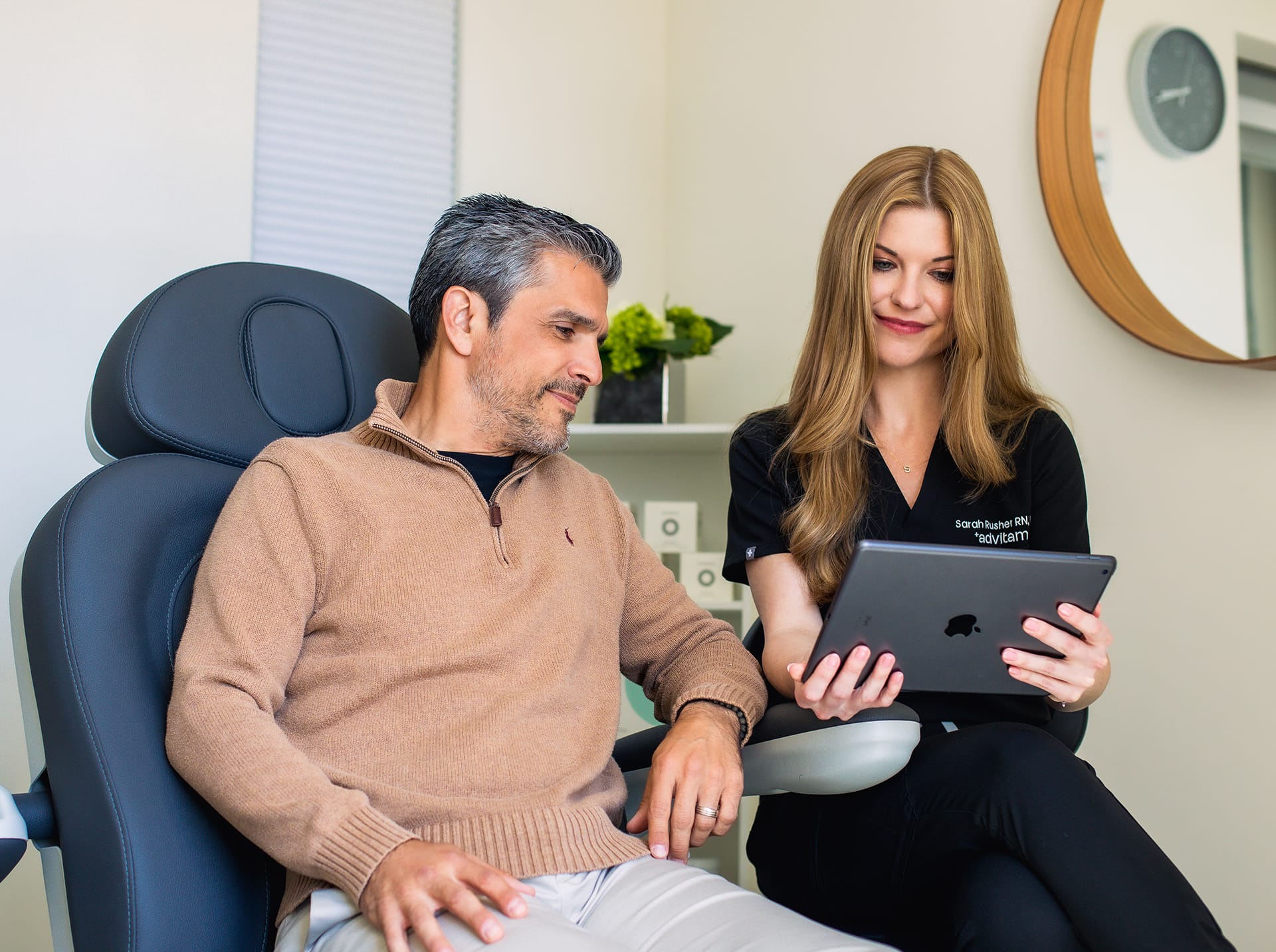 Nurse and patient looking at tablet