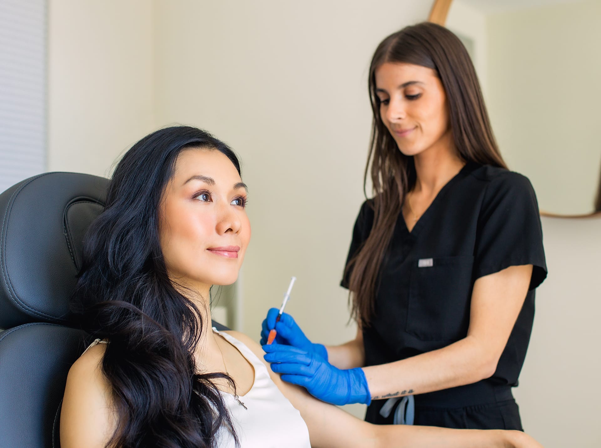 woman getting an injection in her shoulder