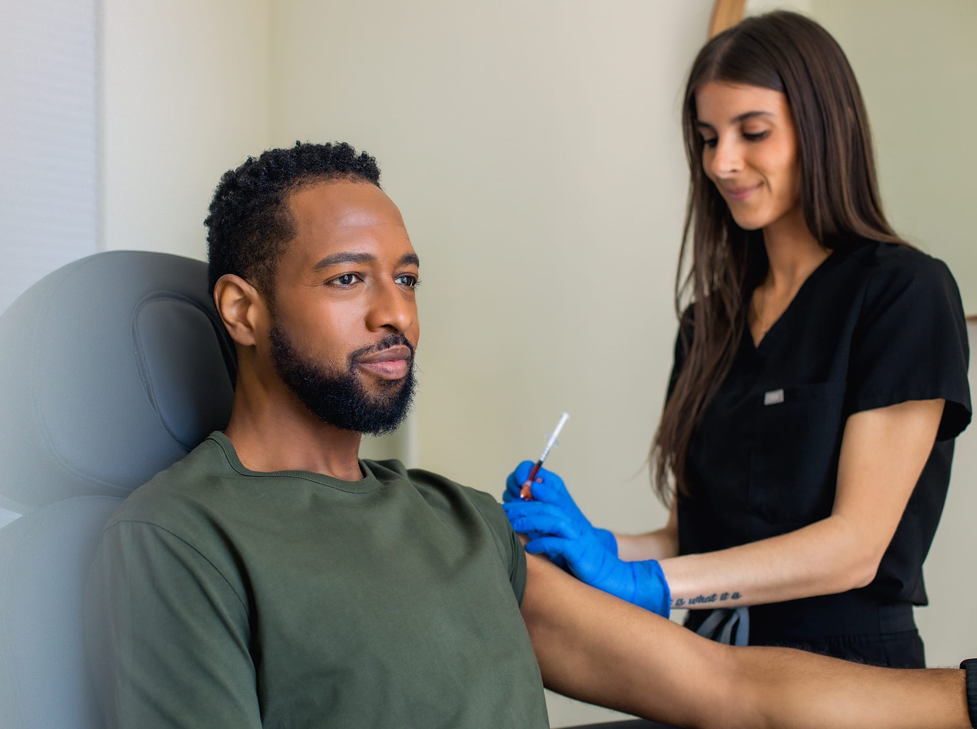 man getting an injectable treatment in his arm