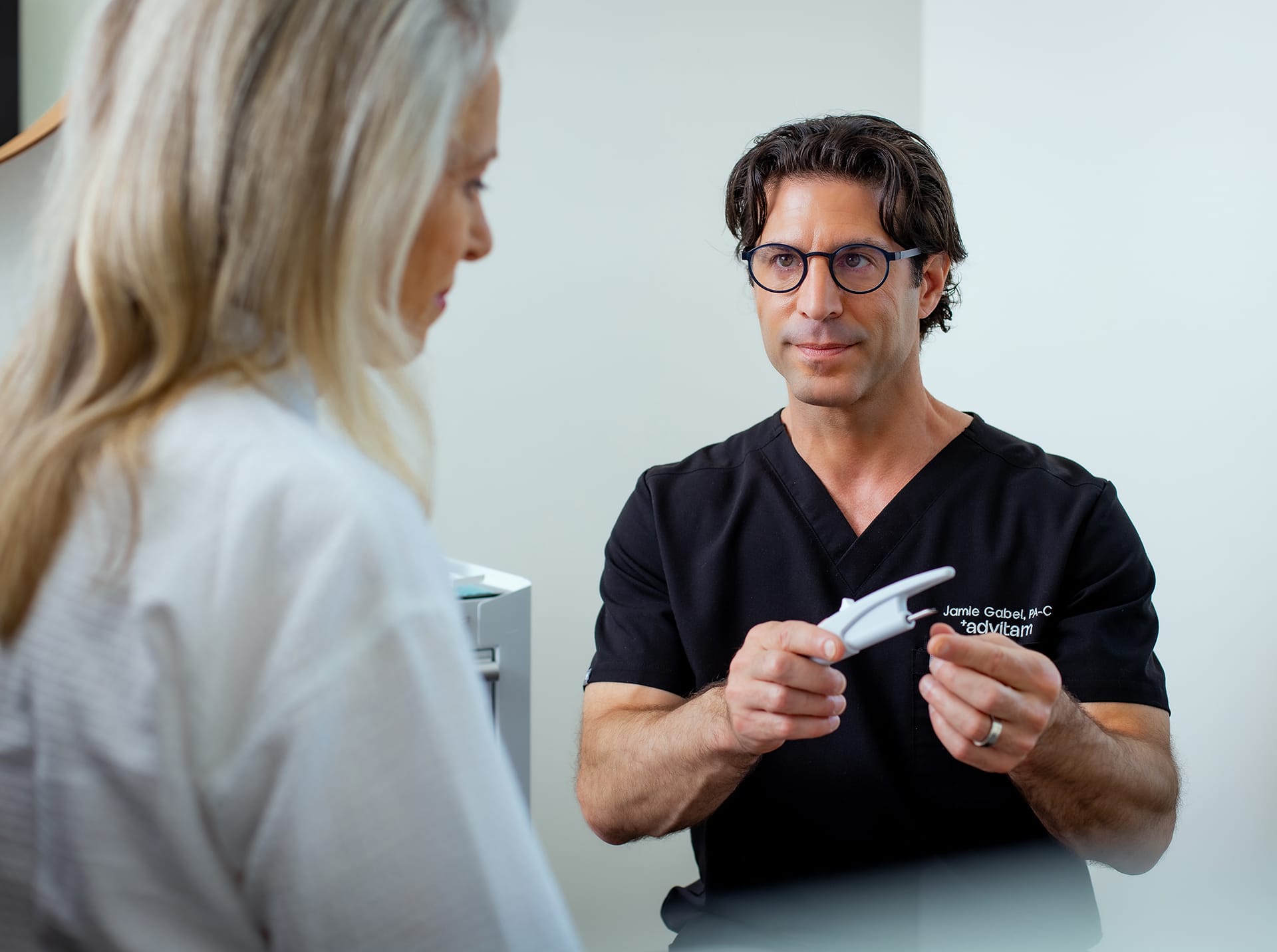 Jamie Gabel MS PA-C with a female patient