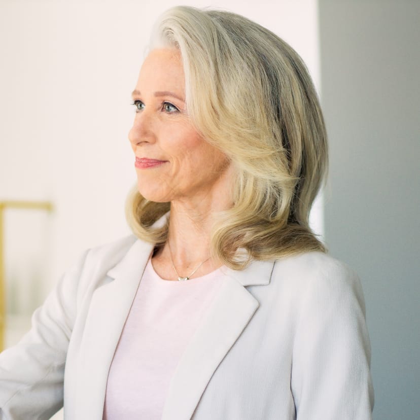 woman wearing a white blazer
